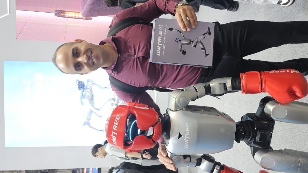 Rachid Atouli with a humanoid robot at WRC 2026